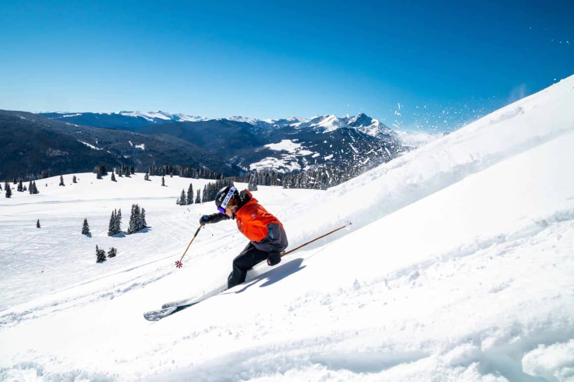 Person skiing in mountainous holiday destination