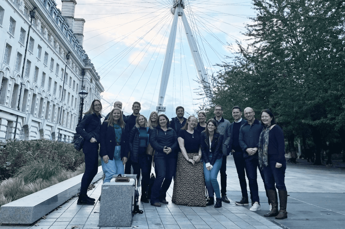 Landscape image of TTC team in front of London landmark
